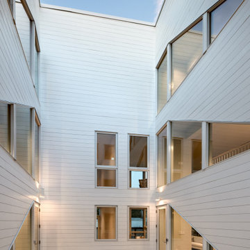 Interior courtyard and light well shared between the four units