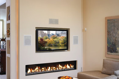 Transitional family room photo in San Francisco with beige walls and a ribbon fireplace