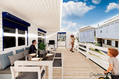 Inspiration pour une grande terrasse latérale et au premier étage marine avec une extension de toiture et un garde-corps en bois.