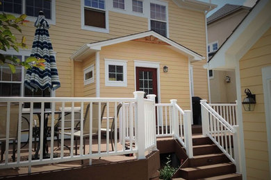 Deck - large traditional backyard deck idea in Denver