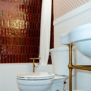 Transitional Guest Bathroom with Statement Tile, Wallpaper & Brass Fixtures