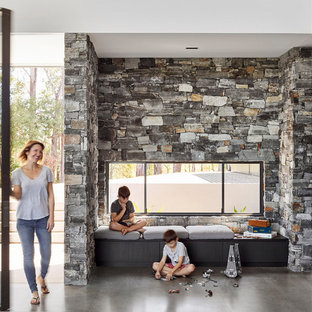 Inspiration for a modern open concept family room in Sunshine Coast with concrete floors and grey floor.
