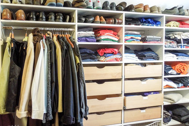 Example of a beach style closet design in Charleston