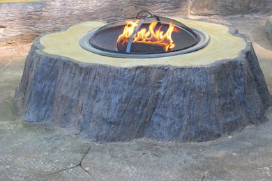 Inspiration for a large transitional backyard stone patio remodel in Philadelphia with a fire pit and a pergola