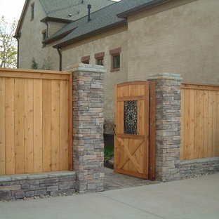Photo of a large traditional two-storey beige exterior in Nashville with mixed siding.
