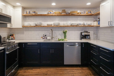 Enclosed kitchen - small transitional u-shaped medium tone wood floor and brown floor enclosed kitchen idea in San Francisco with a single-bowl sink, shaker cabinets, white cabinets, quartzite countertops, white backsplash, ceramic backsplash, stainless steel appliances, no island and white countertops