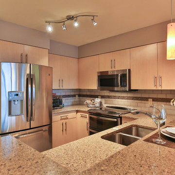 An inviting kitchen lightly staged to not distract from the beautiful finish wor