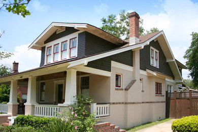 Example of a mid-sized arts and crafts multicolored two-story mixed siding exterior home design in Jacksonville with a tile roof