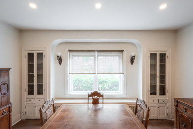 Inspiration for a mid-sized french country dark wood floor and brown floor enclosed dining room remodel in Montreal with beige walls