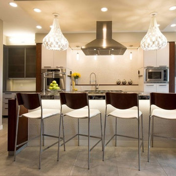 Verde Marinace granite Island countertop,. Perimeter- Caesarstone quartz