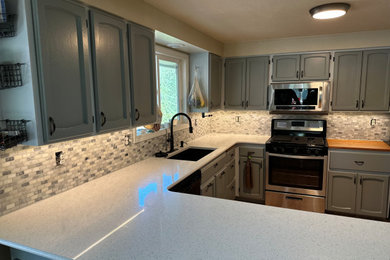 Kitchen - 1950s kitchen idea in Other with stainless steel appliances