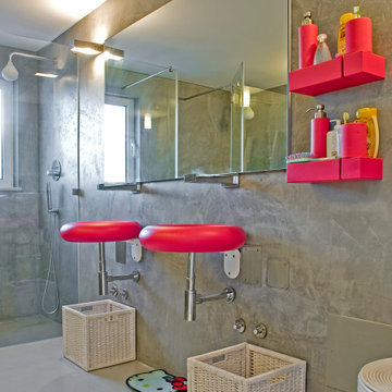 Gray Bathroom with Fuchsia Basins and Red Accents