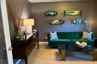 Example of a transitional enclosed carpeted family room library design in Salt Lake City with gray walls and no tv