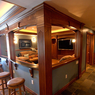 Large traditional open plan home cinema in Detroit with blue walls, terracotta flooring and a built-in media unit.