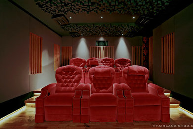 Inspiration for a medium sized classic enclosed home cinema in Other with light hardwood flooring and a projector screen.