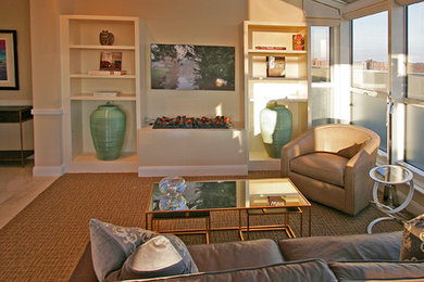 Mid-sized transitional open concept carpeted and brown floor living room photo in New York with beige walls, a two-sided fireplace and a wall-mounted tv