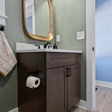 Warm and Cohesive Multi-Bathroom Design In Nokesville