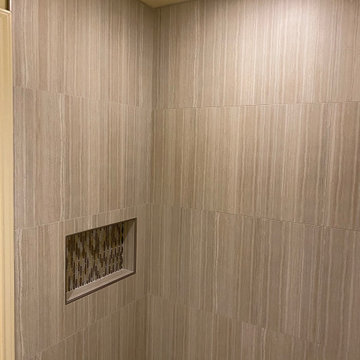 MASTER BATHROOM - Tub-To-Shower 12" x 24" Gray Porcelain Tile Vertically Aligned