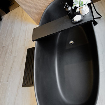 Modern Luxury Master Bathroom with Black Solid Surface Tub
