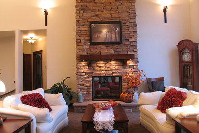 Elegant open concept carpeted living room photo in Seattle with beige walls, a standard fireplace and a stone fireplace