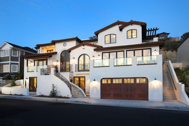This is an example of a three-storey concrete beige exterior in Orange County.