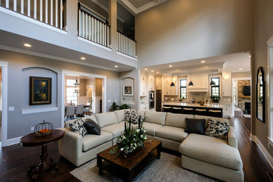 Family room - mid-sized traditional open concept dark wood floor family room idea in Detroit with gray walls