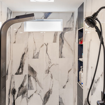 Bathroom remodeling in Columbia, MD with double vanity & marble bathtub