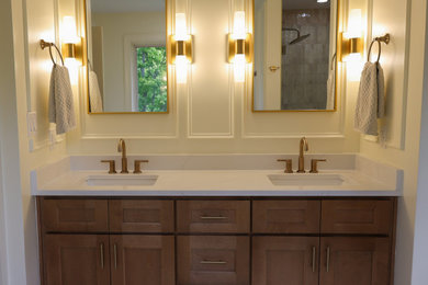Bathroom - large transitional master subway tile and beige tile ceramic tile, double-sink and multicolored floor bathroom idea in Other with a one-piece toilet, white walls, an undermount sink, quartzite countertops, white countertops, a niche, shaker cabinets, medium tone wood cabinets, a built-in vanity and a hinged shower door