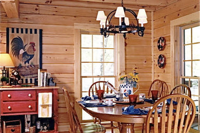 Example of a mountain style light wood floor dining room design in Other with brown walls