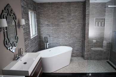 Inspiration for a mid-sized modern master gray tile bathroom remodel in Toronto with furniture-like cabinets, medium tone wood cabinets and quartz countertops