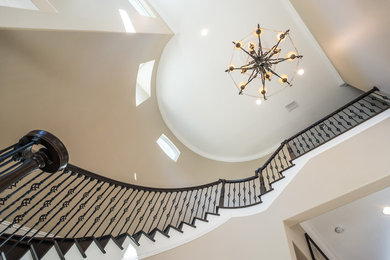 Inspiration for a large timeless travertine floor entryway remodel in Orlando with beige walls and a glass front door