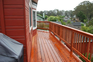Example of a mid-sized mountain style side yard outdoor kitchen deck design in San Francisco with no cover