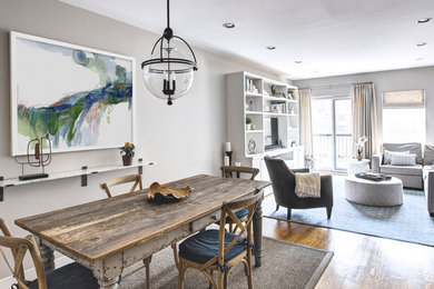 Great room - mid-sized transitional medium tone wood floor and brown floor great room idea in New York with gray walls and no fireplace