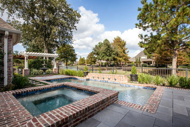 Inspiration for a transitional pool in Houston.
