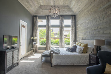 Example of a large transitional master carpeted bedroom design in Houston with gray walls