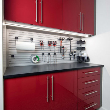Custom Garage Cabinets with High-Gloss Red Finish and Organized Tool Storage