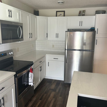 Kitchen Remodel with White Refaced Cabinets and Quartz Tops
