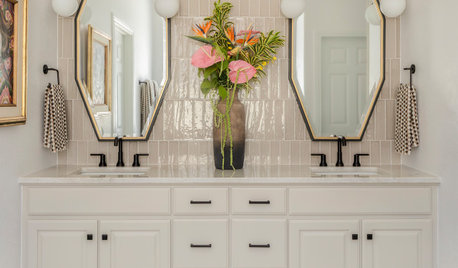 Warm and Refined Bathroom With a Striking Green Shower