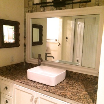 Bathroom redo with framed mirror and antique mirror tiles