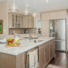 Beverage area with wine storage next to glasses.