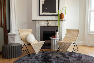 Example of a trendy home office design in San Francisco with a standard fireplace and a stone fireplace