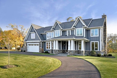 Inspiration for a mid-sized craftsman gray two-story mixed siding gable roof remodel in Chicago with a shingle roof