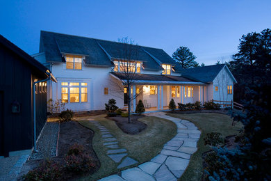 Example of a large classic white two-story concrete fiberboard gable roof design in Boston