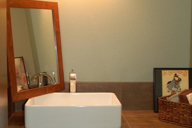 Mid-sized 3/4 gray tile and stone tile bathroom photo in Portland with a vessel sink, flat-panel cabinets, medium tone wood cabinets and tile countertops