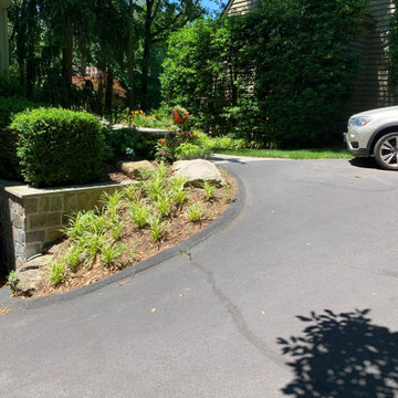 Walkway, retaining walls, plantings and stone stairs and front stoop