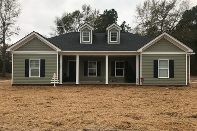 Inspiration for a mid-sized timeless exterior home remodel in Other