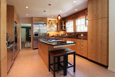 Enclosed kitchen - large contemporary u-shaped linoleum floor and beige floor enclosed kitchen idea in Houston with flat-panel cabinets, medium tone wood cabinets, brown backsplash, stainless steel appliances, an island, an undermount sink, granite countertops and subway tile backsplash