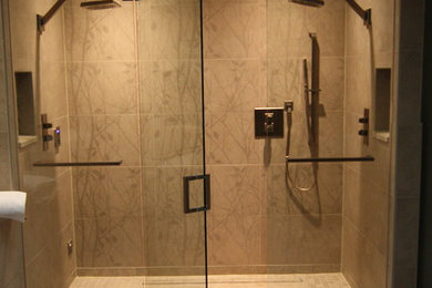 Alcove shower - modern cement tile floor and gray floor alcove shower idea in Denver with a hinged shower door
