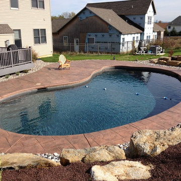 Forks Township kidney shape pool with boulder retaining wall