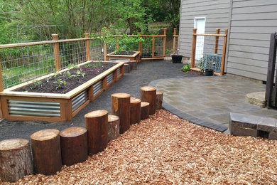 Inspiration for a small country backyard partial sun garden in Portland.